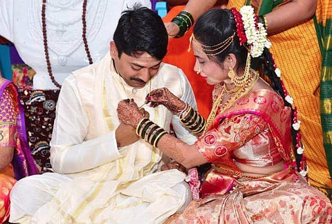 One of the couples at the unusual wedding in Karnataka where the bride tied the mangalsutra, and not the groom! (Video screengrab)