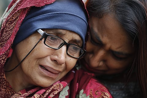 A woman who lost her husband during Friday's mass shootings cries outside an information center for families on 16 March 2019. (Photo | AP)