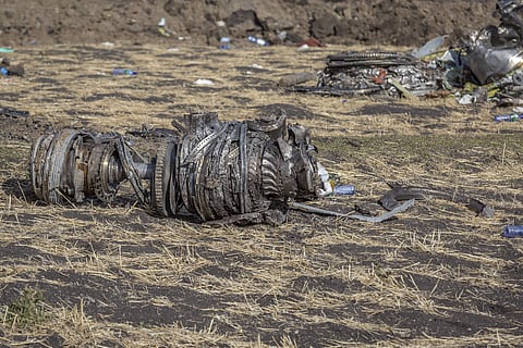 Airplane parts lie on the ground at the scene of an Ethiopian Airlines flight crash. (AP photo)