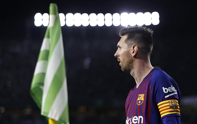 Messi playing for his club Barcelona 
