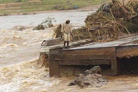 Schoolchildren are stranded across a collapsed bridge in Chimanimani, southeast of Harare, Zimbabwe, Monday, March 18, 2019. (Photo | AP)