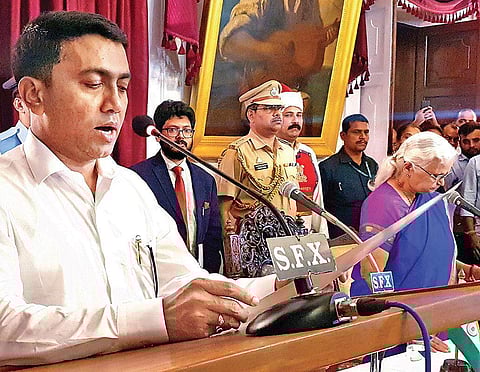 Governor Mridula Sinha (R) administers the oath of office to Pramod Sawant as the new Goa Chief Minister, at the Raj Bhavan in Panaji on Tuesday| PTI