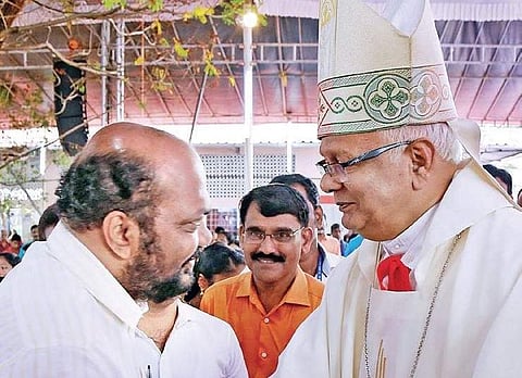 Bishop Joseph Kariyil shakes hands with P Rajeev, LDF candidate in Ernakulam constituency, at the pilgrim centre of St Antony’s Church, Kannamali, on Tuesday