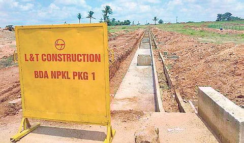 Infrastructure work came to a standstill at KG layout due to agitation by farmers  |Express