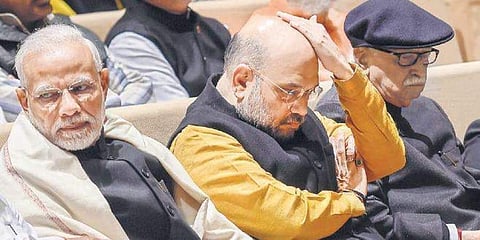Narendra Modi, Amit Shah and L K Advani at a meeting in New Delhi. (Photo | PTI)