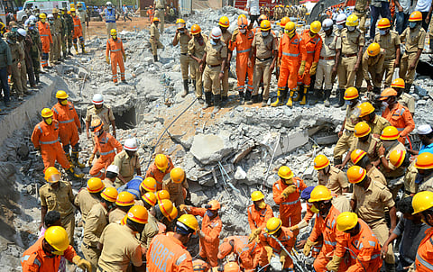 The ongoing repair work of columns at the basement area of the under-construction building in Dharwad is said to be a possible reason for its collapse. (Photo | D Hemanth, EPS)