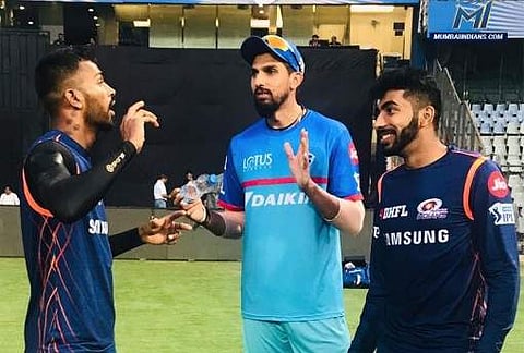 Delhi Capitals pacer Ishant Sharma interacts with Mumbai Indians players Hardik Pandya (L) and Jasprit Bumrah (Photo | Twitter@mipaltan)