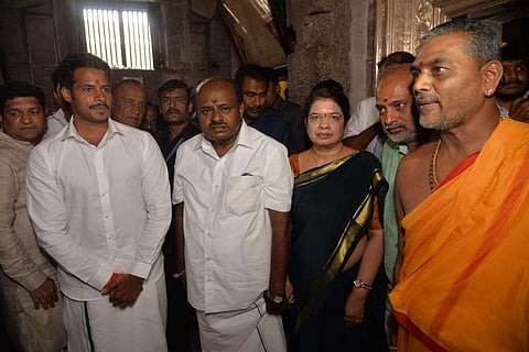 Chief Minister H D Kumaraswamy and his son Nikhil Kumaraswamy, the Mandya Lok Sabha constituency candidate, are seen offering puja at Sri Chamundeshwari Devi Temple atop Chamundi Hill in Mysuru before filing nomination papers. (Photo | Express)