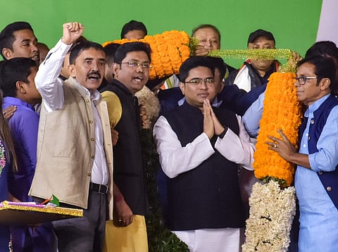 TMC party activists garland party MP Aveshek Banerjee as they welcome him into the party in Kolkata. (File | PTI)