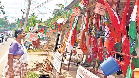 An elderly woman looking at the campaign materials displayed at a shop at Malayinkeezhu in Thiruvanathapuram.| Vincent Pulickal