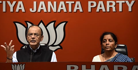 Union Finance Minister Arun Jaitley addresses a press conference as Union Defence Minister Nirmala Sitharaman looks on at Bharatiya Janata Party BJP headquarters in New Delhi on Friday. (Photo | Parveen Negi, EPS)