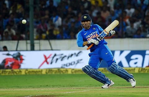 Indian cricketer MS Dhoni plays a shot against Australia during the first One Day International cricket match in Hyderabad. (EPS | R.Satish Babu)