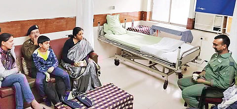 Defence Minister Nirmala Sitharaman meets IAF Wg Cdr Abhinandan Varthaman at the Army’s RR hospital, in New Delhi on Saturday. | PTI