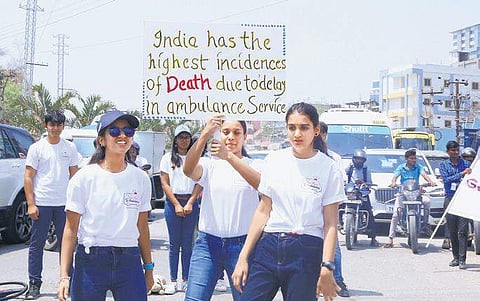 Students spread awareness to ‘Give Way to Ambulance’ through street play on the World Theatre Day in Hyderabad on Saturday. (Photo | EPS)