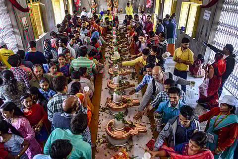Devotees offer prayer at a temple on the occasion of 'Maha Shivaratri' festival during the ongoing Kumbh Mela in Prayagraj. | PTI