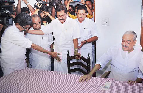 KPCC president Mullappally Ramachandran offers the chair to Kerala Congress leader P J Joseph, during the bilateral talks in Ernakulam on Sunday | A Sanesh