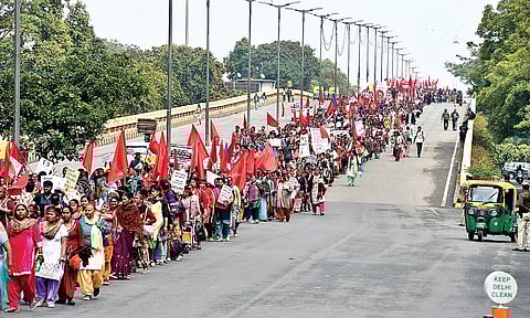 Protesters take out a Rozgaar Adhikar Rally, demanding that right to employment be made a fundamental right, in New Delhi on Sunday | Parveen Negi