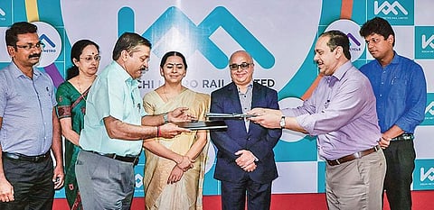 KMRL MD A P M Mohammed Hanish and Bhavanam Foundation of Kerala COO Muraleedharan G L exchanging the MoU in the presence of Chief Secretary Tom Jose at KMRL office in Kochi