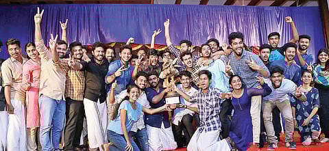 Sacred Heart College, champions of Mahatma Gandhi University Arts Festival, with the trophy (Photo | EPS)
