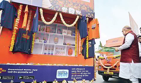 BJP president Amit Shah flags off Namo Merchandise Rath, an outreach initiative, at the party headquarters in New Delhi on Monday | Naveen Kumar