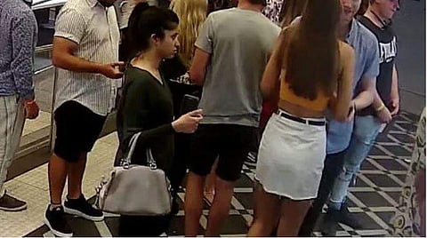 Preethi Reddy (with handbag) was last seen on CCTV waiting in line at McDonald's, Sydney. (Photo: Facebook)