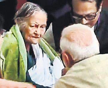 Videograb of Prime Minister Narendra Modi with Baroma Binapani Devi, supreme leader of the Matua Mahasangh, a Dalit reformist movement
