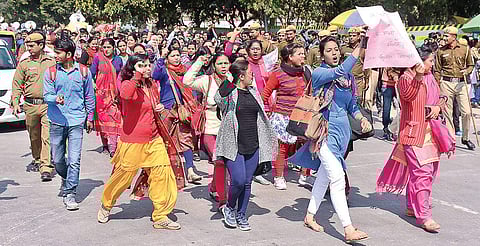 Guest teachers protest outside Deputy CM Manish Sisodia’s residence in New Delhi on Wednesday | Naveen Kumar