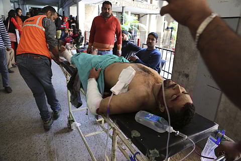 A person injured in a grenade attack is carried for treatment to a government medical hospital in Jammu, India, Thursday, March 7, 2019. This is the third grenade attack by terrorists in Jammu bus stand since May last year, viewed by security agencies as an attempt to disturb communal harmony and peace in the city. (Photo| AP)