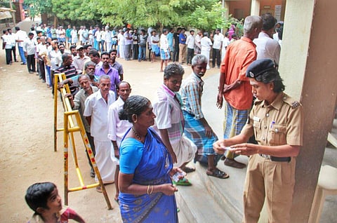 People waiting in queue to cast their votes in a polling booth in Madurai, Tamil Nadu