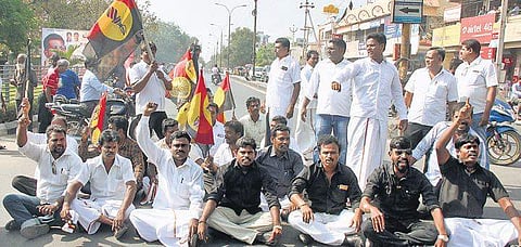 DMKDK supporters staging a road block in Katpadi on Friday | Express