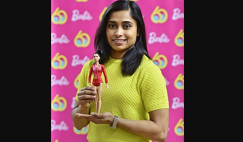 Star gymnast Dipa Karmakar with one-of-a-kind doll presented to her to commemorate Barbie's 60th anniversary. (Photo: PTI)