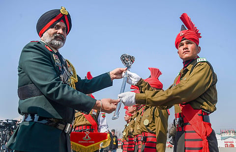 Srinagar 15 Corps commander Lt General KJS Dhillon presenting Sher-e-Kashmir sword of honour to over all best recruit Sahil Sharma after the 117th Passing Out Parade of Jammu and Kashmir Light Infantry Regimental Centre JAKLI on the outskirts of Srinagar 