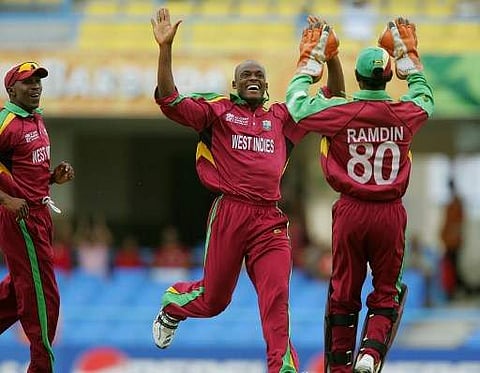 Powell (C) finished as his side's leading wicket-taker during the tournament | AFP