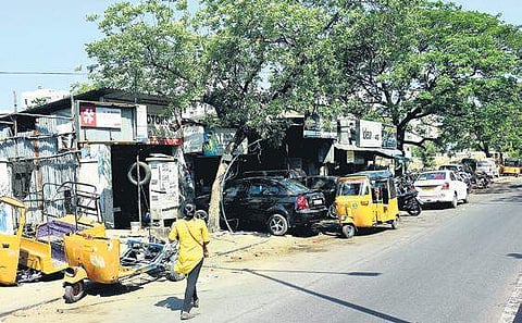 Seven automobile shops at Greams road continue to stand even though all 603 other houses in the area were razed down as part of Cooum river restoration project  | Ashwin Prasath
