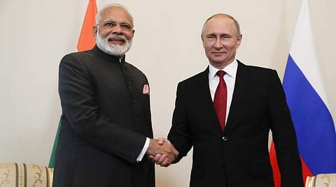 Russian President Vladimir Putin, right, shakes hands with India's Prime Minister Narendra Modi. (Photo | File/ AP)