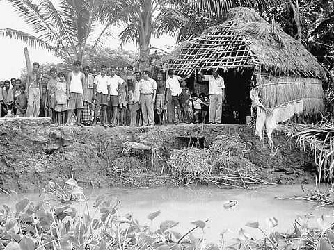 Residents of Katana village gather at a spot affected by river erosion | Express