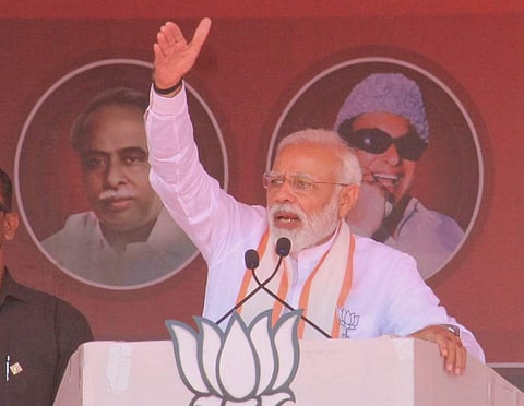 The Prime Minister Narendra Modi is seen addressing the gathering during the campaign meeting organised near Theni on Saturday (KK Sundar | EPS)