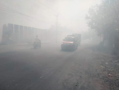 Smoke from the dumpyard fire hampered vision of motorists on Chitlapakkam second main road on Saturday | Express