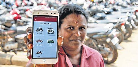A Kudumbashree member displays the app  B P Deepu