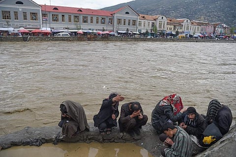 Afghan drug addicts smoke opium along the Kabul river after heavy rains in Kabul (Photo|AFP)