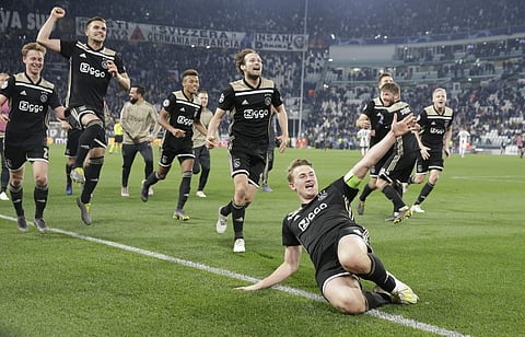 Ajax's Matthijs de Ligt and teammates celebrate at the end of the Champions League, quarterfinal, second leg soccer match between Juventus and Ajax, at the Allianz stadium in Turin. (Photo | AP)