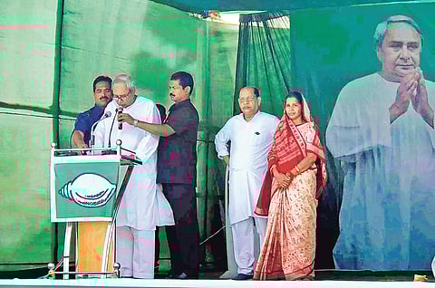 CM Naveen Patnaik speaking at election meeting in Bijepur on Tuesday. BJD’s Bargarh MP candidate Prasanna Acharya and Bijepur MLA Rita Sahu are also present | Express