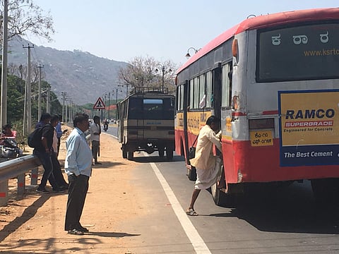 Several trees were chopped off for the development of the Mysuru-Nanjangud road near Gun House, leaving commuters stranded. (Photo: EPS)