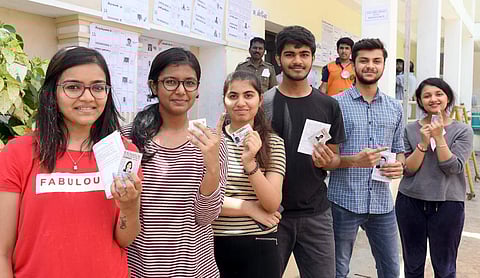 First time voters show their finger marked with indelible ink, after casting their vote at Agarwal Vidyala in EVK Sampath Salai, Chennai.(Photo | Martin Louis,EPS)
