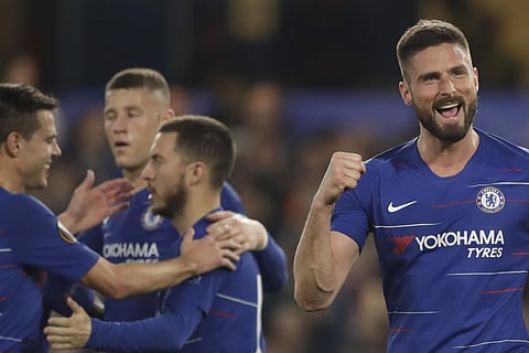 Chelsea's Olivier Giroud, the Europa League's top scorer, right, celebrates scoring his side's third goal during the Europa League quarterfinal, second leg, soccer match between Chelsea and Slavia Prague at Stamford Bridge stadium. (Photo | AP)