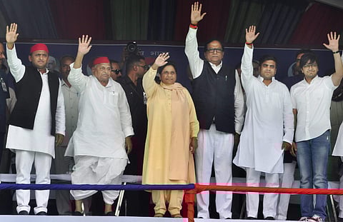 Samajwadi Party patron Mulayam Singh Yadav his son and party President Akhilesh Yadav Bahujan Samaj Party supremo Mayawati BSP general secretary Satish Chandra Mishra and SP's Akshay Yadav and BSP's Akash Anand wave at crowd during their joint election ca