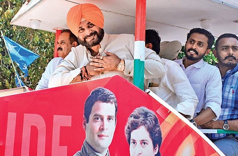 Punjab Minister and former cricketer Navjot Singh Sidhu greeting public  during the road show of the campaign rally for UDF Candidate M K Raghavan in Kozhikode on Thursday | Express