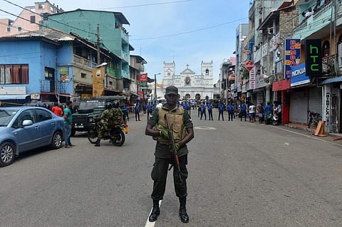 Sri Lankan security personnel keep watch outside the church premises following a blast at the St. Anthony's Shrine in Kochchikade, Colombo. (Photo | AFP)
