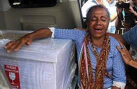 In this file photo taken on February 17, 2018, Petronela Koa cries next to the coffin containing her niece Adelina Sau, a domestic helper who died in Malaysia. (Photo | AFP)