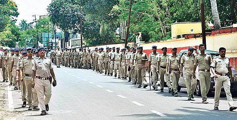 Security personnel conduct flag march a day ahead of elections in Bhubaneswar, on Monday | Express